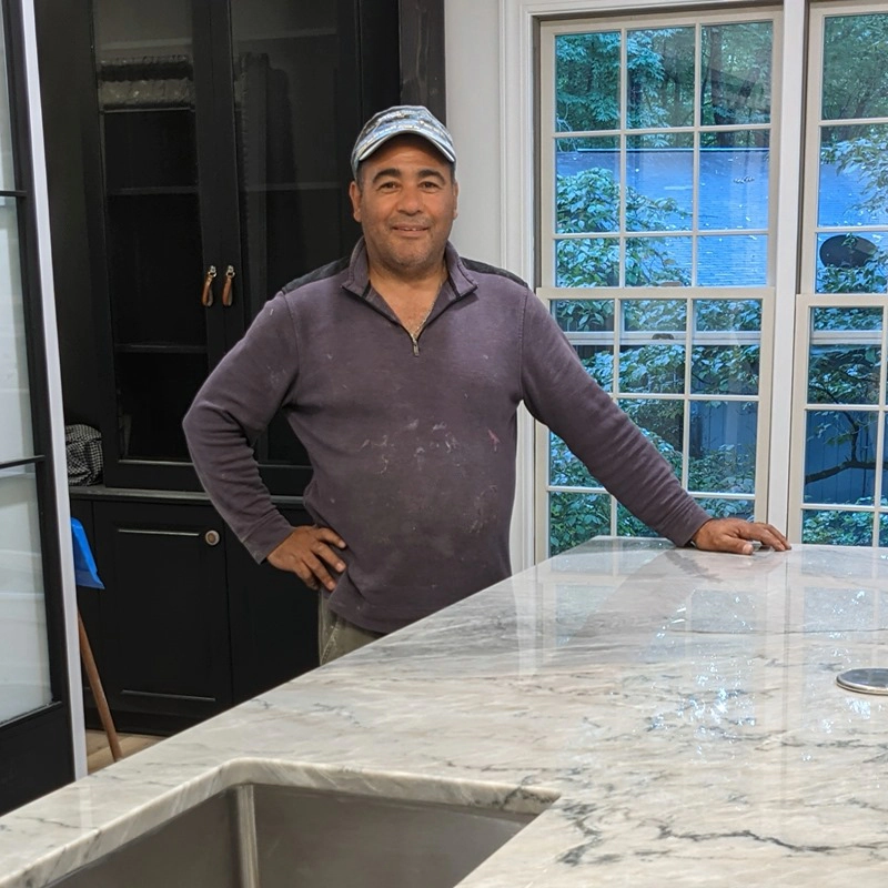 a person posing with the newly installed countertop